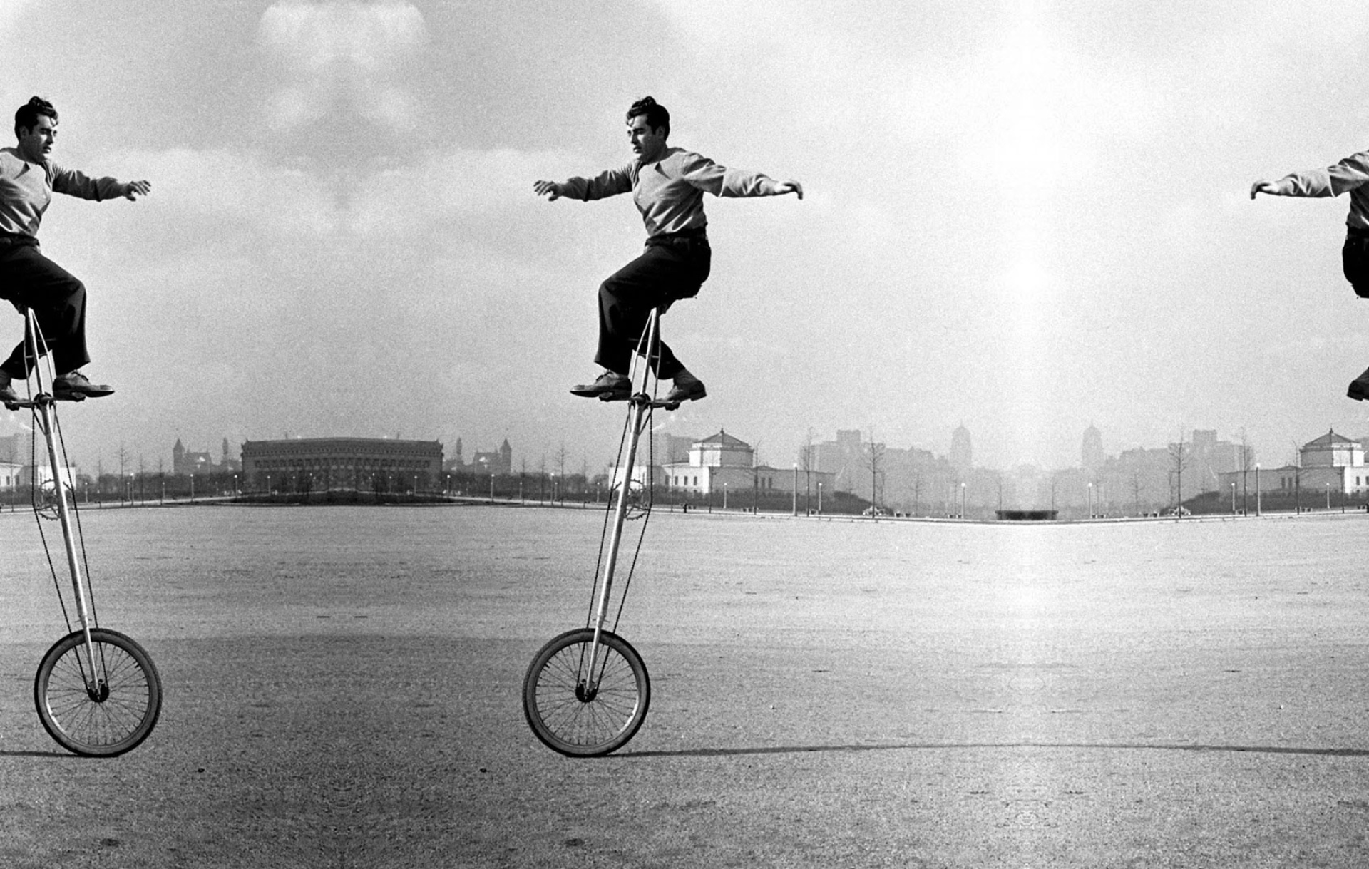 Historical photo man driving unicycle